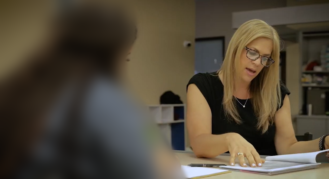 Lori Kowit providing individualized coaching; the participant is blurred for privacy